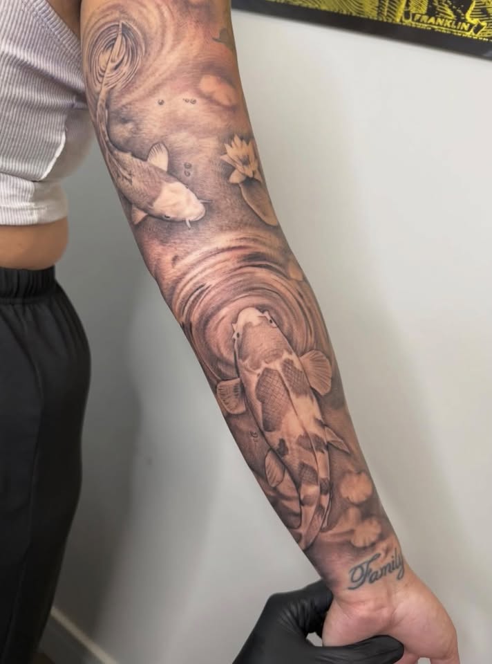Koi in motion, tattoo by Jinks